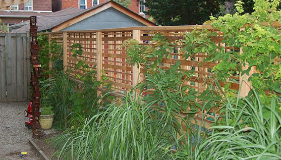 View of custom cedar fence and landscaping from deck